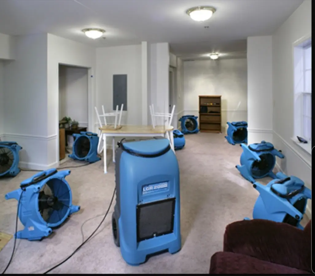 Air movers and dehumidifier setup for Water Damage Restoration in Benson